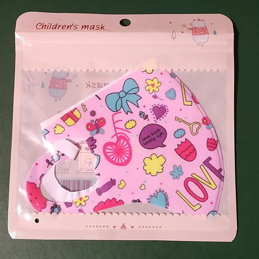 Children's re Usable face mask new in package never opened